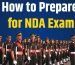 Student studying with books and notes on how to prepare for NDA exam effectively with a complete guide for aspirants.